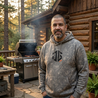 Deadwood camo hoodie with a large black JGTees monogram on the front